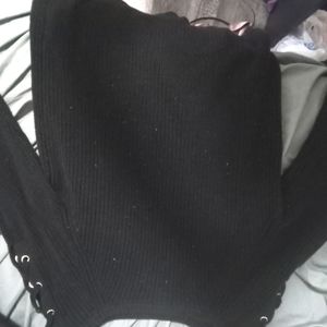 Long black knitted sweater with stitched shoulder details